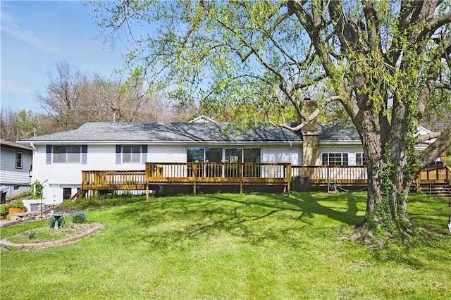 13 P Lake Shore Dr, Lake Lotawana, MO 64086 - back of house with a wooden deck and a lawn