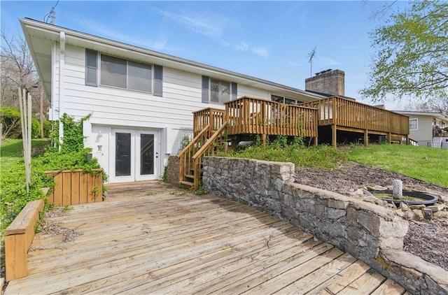 13 P Lake Shore Dr, Lake Lotawana, MO 64086 - back of house with a wooden deck and stairway