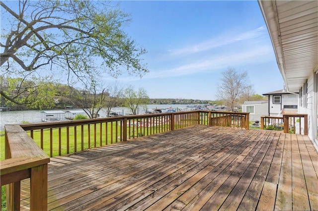 13 P Lake Shore Dr, Lake Lotawana, MO 64086 - deck with a water view and a lawn