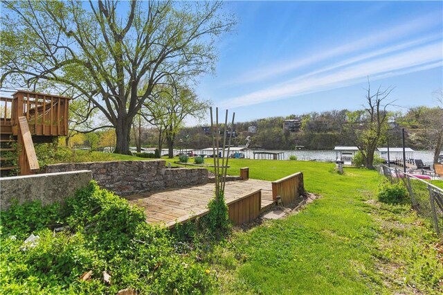 13 P Lake Shore Dr, Lake Lotawana, MO 64086 - surrounding community featuring a deck with water view