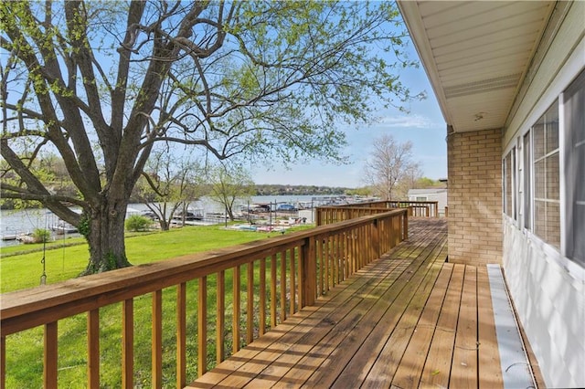 13 P Lake Shore Dr, Lake Lotawana, MO 64086 - wooden deck featuring a water view and a lawn