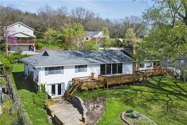 13 P Lake Shore Dr, Lake Lotawana, MO 64086 - rear view of property with stairway, a wooden deck, a lawn, a shingled roof, and a chimney