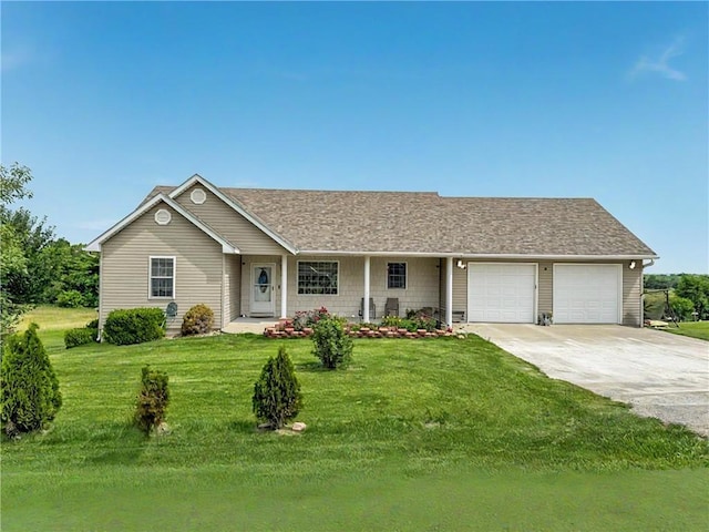 27223 Rolling Hills Dr, Maryville, MO 64468 - ranch-style house with a garage, driveway, a front yard, and a porch