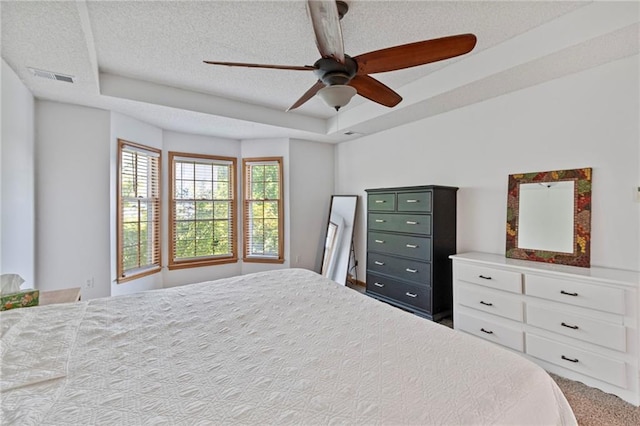 9000 W 127th Ter, Overland Park, KS 66213 - bedroom with a raised ceiling, carpet, a textured ceiling, and a ceiling fan