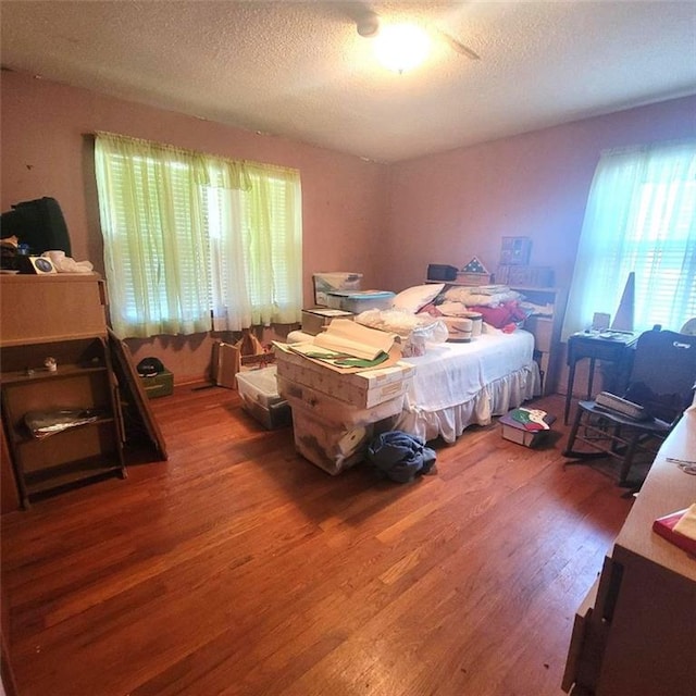 503 Hickory St, Richmond, MO 64085 - bedroom featuring wood finished floors and a textured ceiling