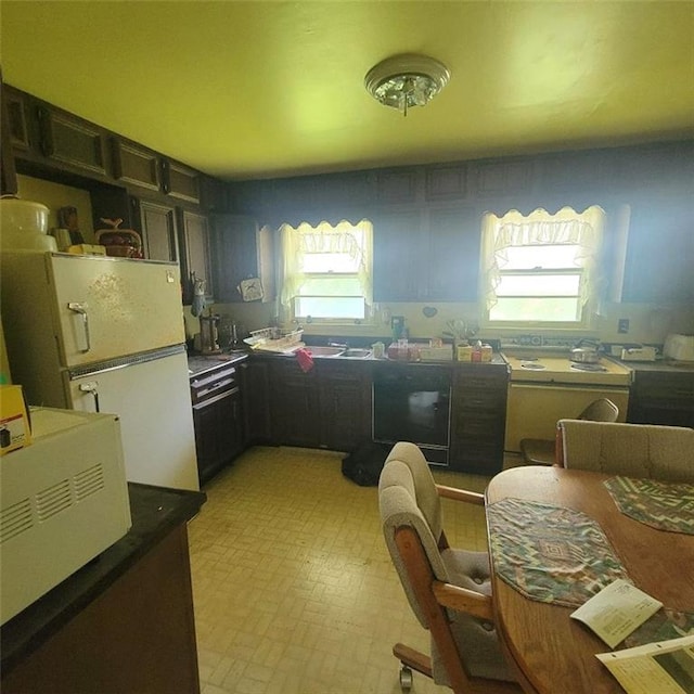 503 Hickory St, Richmond, MO 64085 - kitchen with a desk and dark countertops