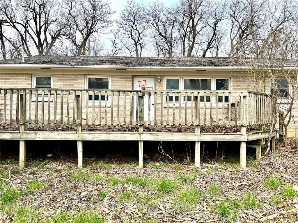 606 K 20th Hwy, Horton, KS 66439 - back of property featuring a wooden deck and brick siding