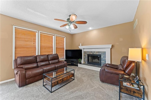 20112 W 220th St, Spring Hill, KS 66083 - carpeted living area with a ceiling fan, a fireplace, and a textured ceiling