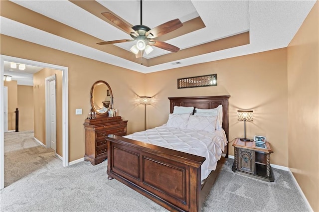 20112 W 220th St, Spring Hill, KS 66083 - bedroom featuring light carpet, a raised ceiling, and a ceiling fan