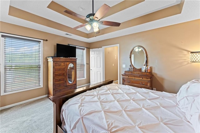 20112 W 220th St, Spring Hill, KS 66083 - carpeted bedroom featuring a raised ceiling and a ceiling fan