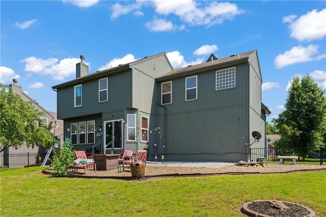 20112 W 220th St, Spring Hill, KS 66083 - back of property featuring an outdoor fire pit, a patio area, and a chimney