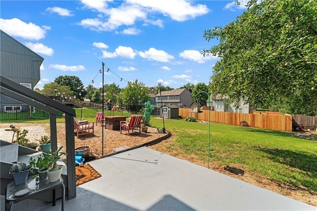 20112 W 220th St, Spring Hill, KS 66083 - fenced backyard with a storage unit, a patio, and an outdoor fire pit