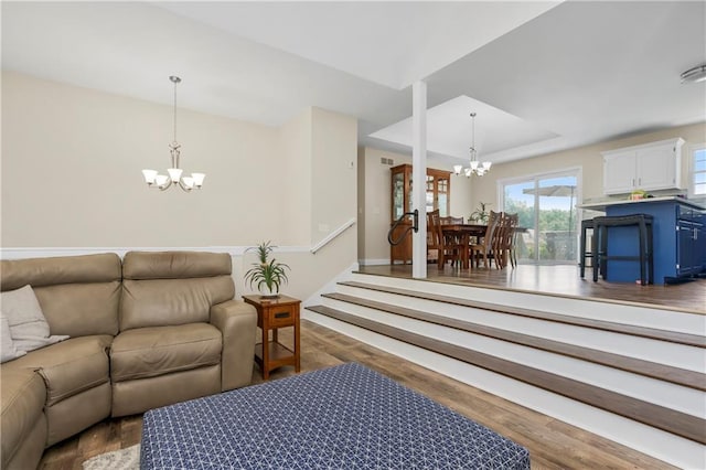 15375 Roger Rd, Leavenworth, KS 66048 - living room with a chandelier, wood finished floors, and a tray ceiling