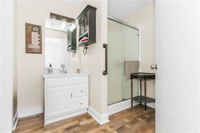 15375 Roger Rd, Leavenworth, KS 66048 - full bath with a stall shower, wood finished floors, and vanity