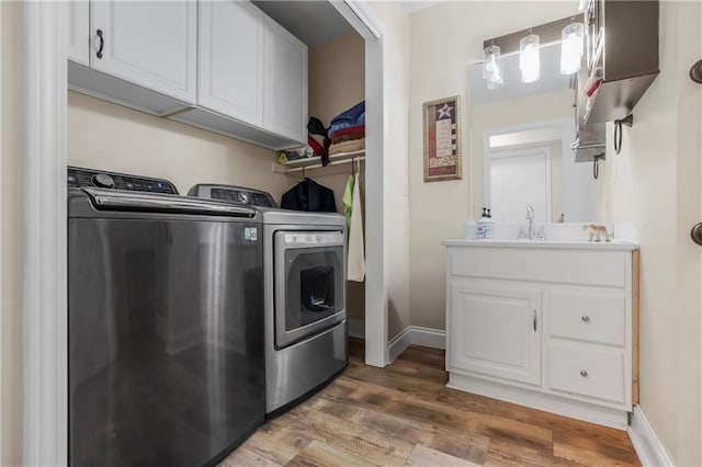 15375 Roger Rd, Leavenworth, KS 66048 - laundry area featuring separate washer and dryer and light wood-type flooring