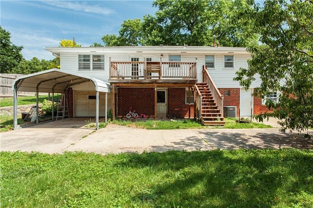 12603 E 37th St N, Sugar Creek, MO 64050 - view of front of property with concrete driveway, a carport, brick siding, a wooden deck, and stairs