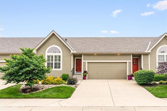 15723 W 61st Ter, Shawnee, KS 66217 - single story home featuring an attached garage, concrete driveway, and stucco siding