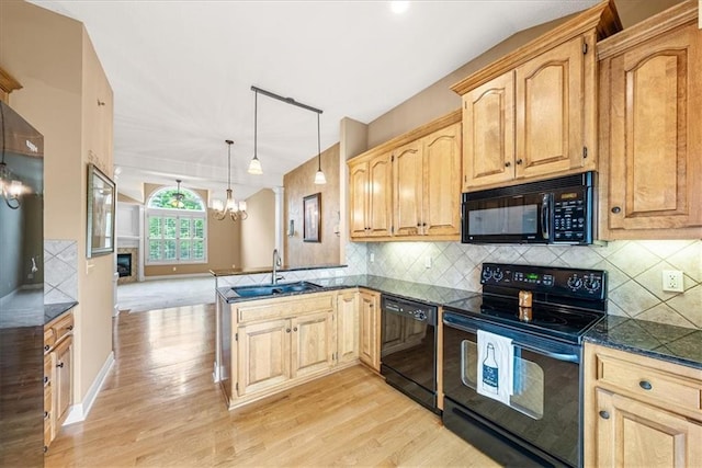 15723 W 61st Ter, Shawnee, KS 66217 - kitchen with black appliances, light wood finished floors, a peninsula, and a chandelier