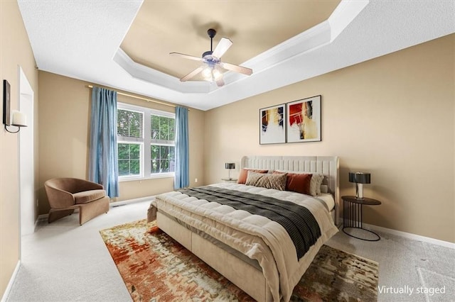 15723 W 61st Ter, Shawnee, KS 66217 - carpeted bedroom featuring a tray ceiling and a ceiling fan