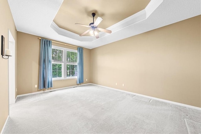 15723 W 61st Ter, Shawnee, KS 66217 - carpeted empty room with a raised ceiling and a ceiling fan