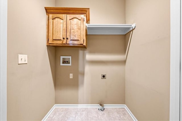 15723 W 61st Ter, Shawnee, KS 66217 - washroom featuring washer hookup, electric dryer hookup, tile patterned floors, and cabinet space