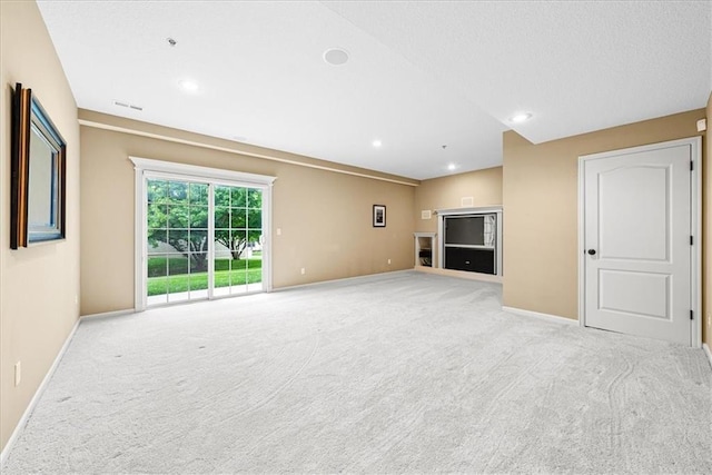 15723 W 61st Ter, Shawnee, KS 66217 - unfurnished living room with light colored carpet and recessed lighting