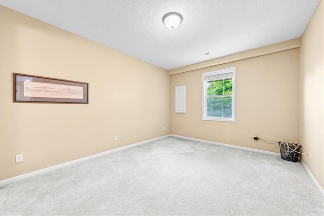 15723 W 61st Ter, Shawnee, KS 66217 - carpeted spare room featuring a textured ceiling and baseboards