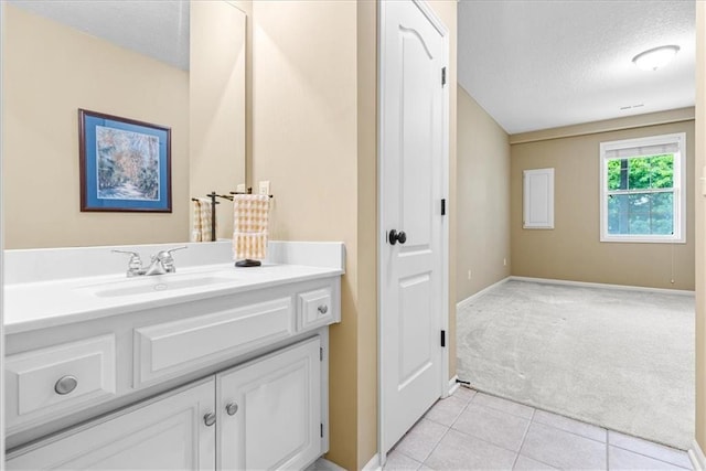 15723 W 61st Ter, Shawnee, KS 66217 - bathroom with a textured ceiling, vanity, and tile patterned flooring
