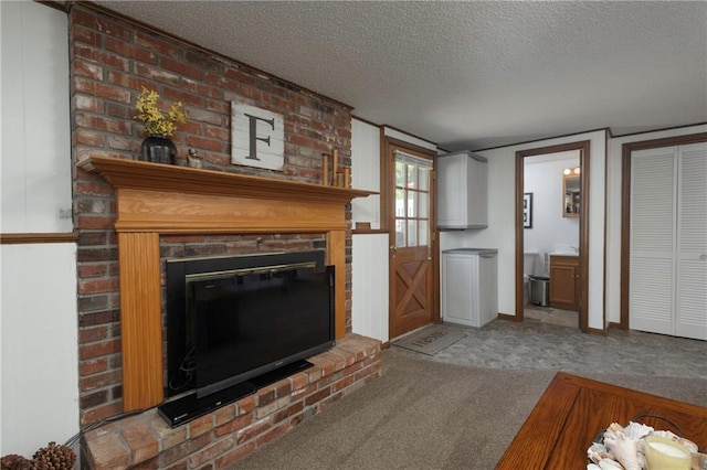 315 Goodrich Dr, Warrensburg, MO 64093 - carpeted living room with a fireplace and a textured ceiling