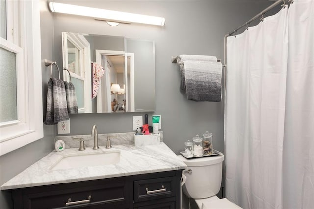 315 Goodrich Dr, Warrensburg, MO 64093 - bathroom featuring vanity and a shower with shower curtain