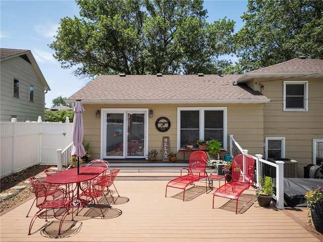 315 Goodrich Dr, Warrensburg, MO 64093 - wooden deck featuring outdoor dining space