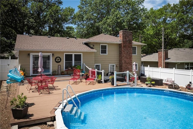 315 Goodrich Dr, Warrensburg, MO 64093 - view of swimming pool with a deck
