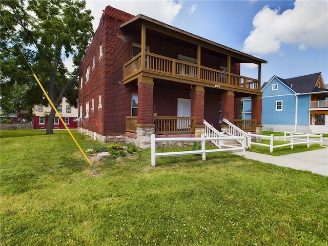 2416 E 22nd St, Kansas City, MO 64127 - view of front of home with brick siding and a balcony