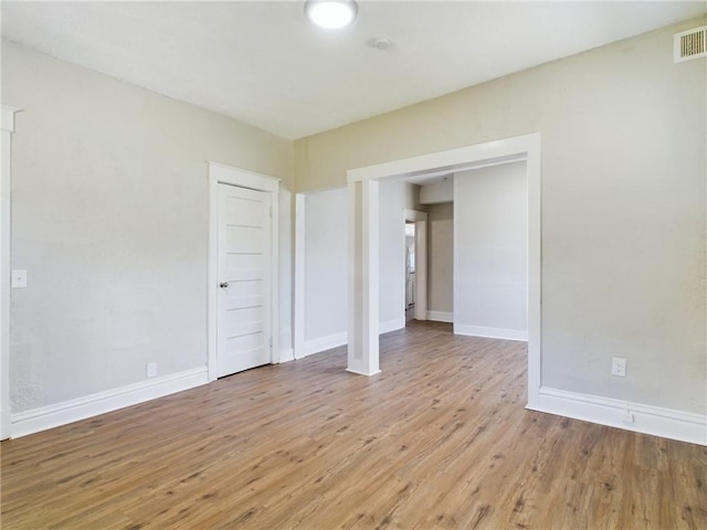 2416 E 22nd St, Kansas City, MO 64127 - unfurnished bedroom with light wood-style flooring and baseboards