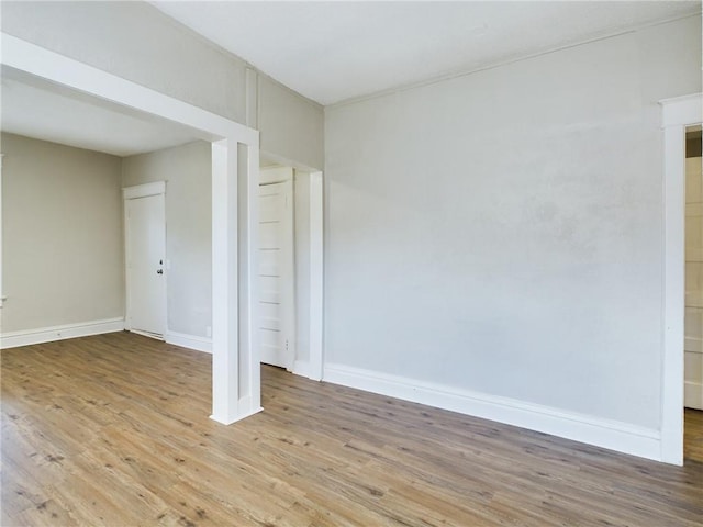 2416 E 22nd St, Kansas City, MO 64127 - unfurnished room with light wood-type flooring