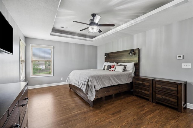 514 NE Viewpark Dr, Lees Summit, MO 64086 - bedroom featuring a raised ceiling, wood finished floors, and a ceiling fan