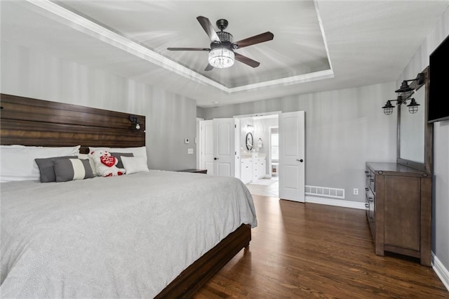 514 NE Viewpark Dr, Lees Summit, MO 64086 - bedroom with a raised ceiling, dark wood-style flooring, and ceiling fan