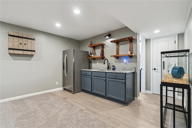 514 NE Viewpark Dr, Lees Summit, MO 64086 - kitchen featuring stainless steel fridge, open shelves, light wood finished floors, recessed lighting, and gray cabinets