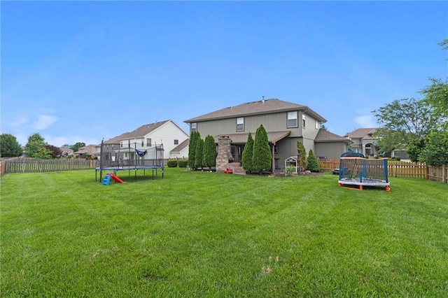 514 NE Viewpark Dr, Lees Summit, MO 64086 - fenced backyard featuring a trampoline