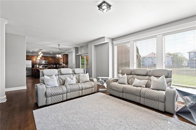 514 NE Viewpark Dr, Lees Summit, MO 64086 - living area with baseboards and dark wood-type flooring