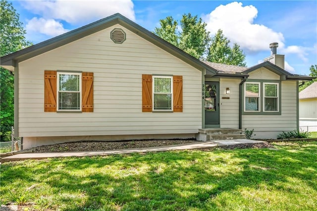 2004 NE Wien Ave, Blue Springs, MO 64029 - ranch-style home with a front lawn and a chimney