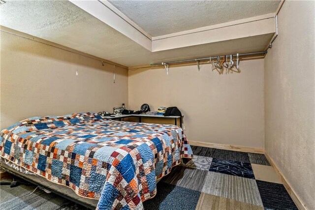 2004 NE Wien Ave, Blue Springs, MO 64029 - bedroom with a textured ceiling and a textured wall