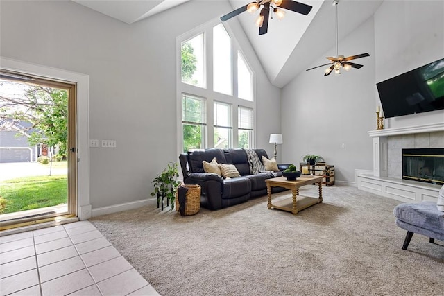 29500 W 184th St, Gardner, KS 66030 - tiled living area featuring carpet, high vaulted ceiling, ceiling fan, and a tile fireplace