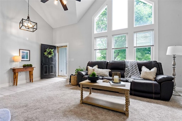 29500 W 184th St, Gardner, KS 66030 - carpeted living room featuring high vaulted ceiling, healthy amount of natural light, a ceiling fan, a chandelier, and tile patterned floors