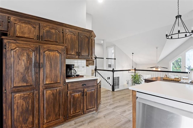 29500 W 184th St, Gardner, KS 66030 - kitchen featuring dishwasher, light countertops, pendant lighting, ceiling fan, and dark brown cabinetry