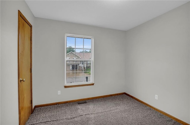 22005 Gracie Dr, Peculiar, MO 64078 - carpeted spare room featuring baseboards
