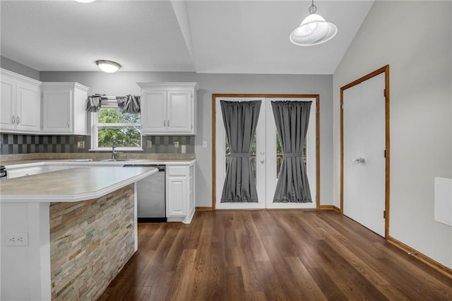 22005 Gracie Dr, Peculiar, MO 64078 - kitchen with dishwasher, light countertops, white cabinetry, dark wood-type flooring, and vaulted ceiling
