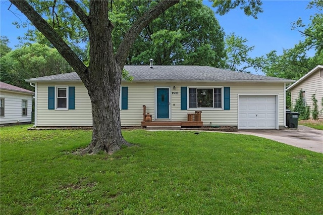 1521 W 22nd St, Lawrence, KS 66046 - single story home with an attached garage, driveway, and a front yard