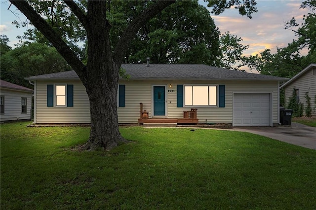 1521 W 22nd St, Lawrence, KS 66046 - single story home featuring a garage, driveway, and a front yard