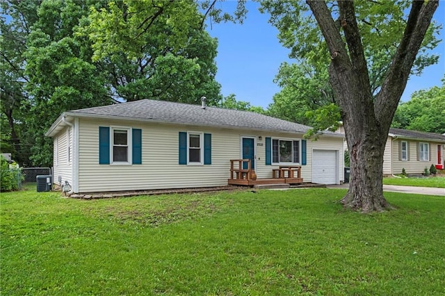 1521 W 22nd St, Lawrence, KS 66046 - ranch-style house featuring an attached garage and concrete driveway